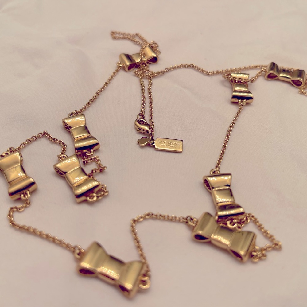 Kate Spade Take a Bow gold plated necklace and matching bracelet and ring